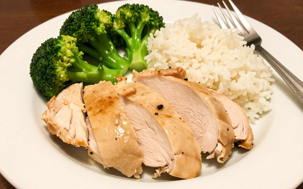 Cooked chicken breast portion plated with vegetables showing a protein serving size in grams