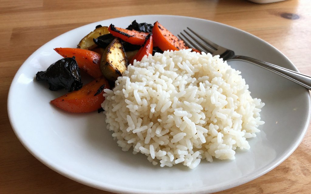 Plated cooked rice serving showing how much rice per person for a meal.