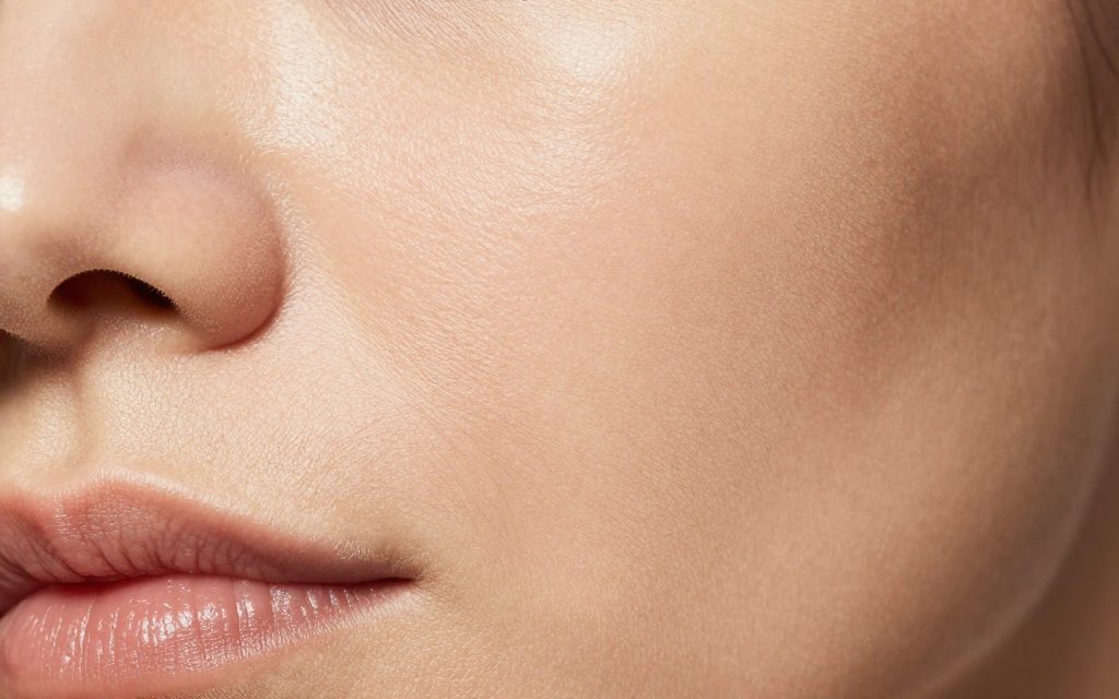 Macro close-up of facial skin and fine lines linked to Ozempic face aging.