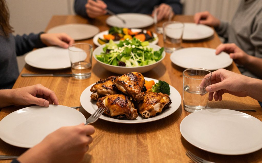 Weeknight dinner table with roasted chicken thighs and salad, showing how a chicken swap fits a week of meals